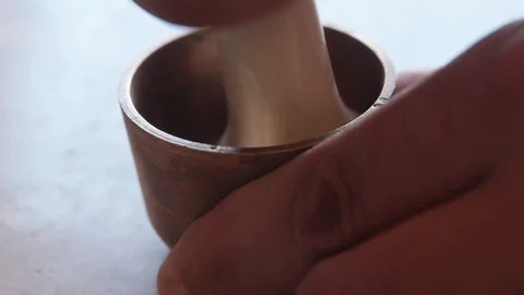 Grinding in a small metal mortar Stock Footage 88701810