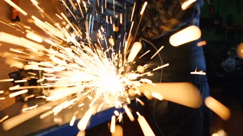 Grinding sparks flying right in to the camera. Slowmotion. Stock Footage 124048191