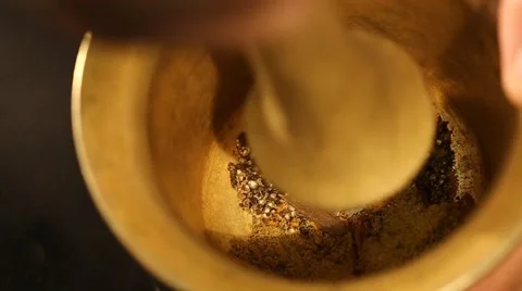 Grinding Spices in an old Mortar and pestle Stock Footage 49500551