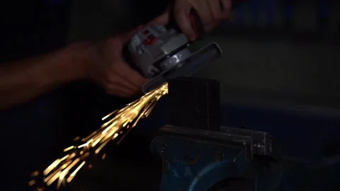 Grinding a steel with an angle grinder with sparks Stock Footage 203855853
