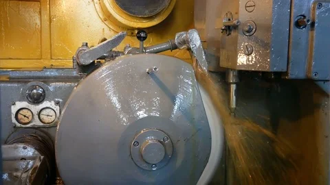 Grinding of teeth. turning machine making grinding of metal part Stock Footage 80156299