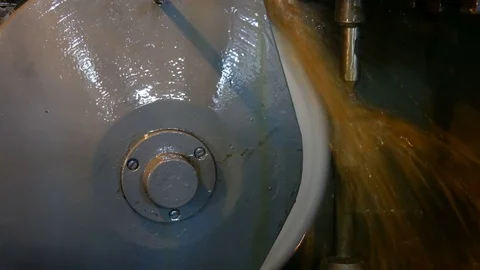 Grinding of teeth. turning machine making grinding of metal part Stock Footage 80156801