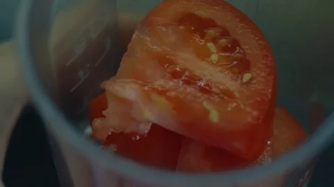 Grinding tomatoes Stock Footage 74958152