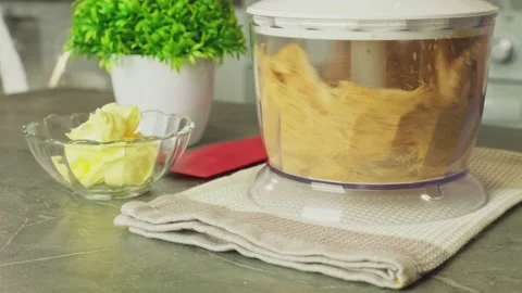 Grinds biscuit in blender mini food processor pulsing until ground cheesecake Stock Footage 229084755