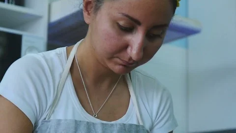 Grinds peanuts slow motion Stock Footage 75517139