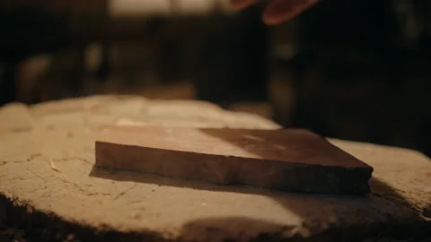 Grindstone is placed on a wooden table Video stock 169156529