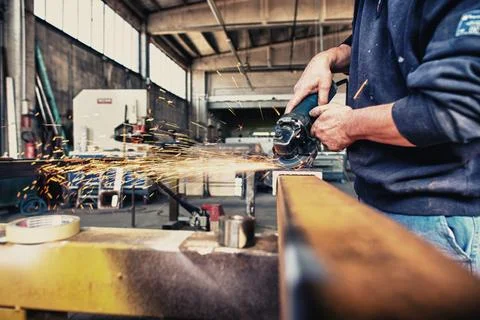 Grindstone at work, industrial environment Stock Photos