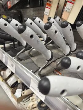Gripped tools lined neatly in a hardware store aisle waiting for eager hands Stock Photos