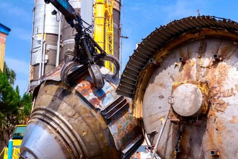 Gripper machine loader, manipulator, catch scrap metal with hydraulic crab Stock Photos