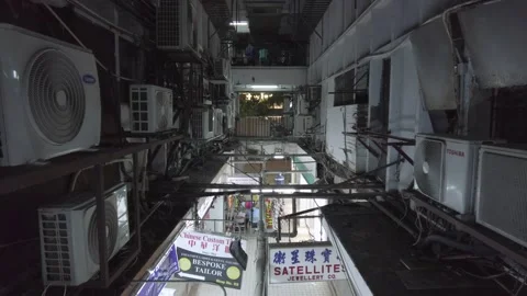 Gritty Corridor in Hong Kong, China with Air Conditioners and Shop Signs Stock Footage 164729972