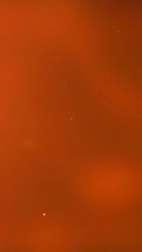 Gritty workshop environment with drifting ember and smoky fumes Filmed on a high Video stock 335395407