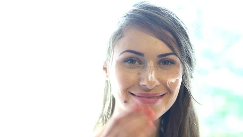 Grl with cream on face. Stock Footage 105777360