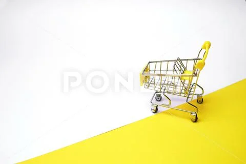 Grocery Basket On Wheels, Minimalism. On Light Background.online Shopping