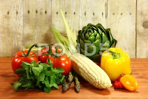 Grocery produce items on a wooden plank Stock Photos