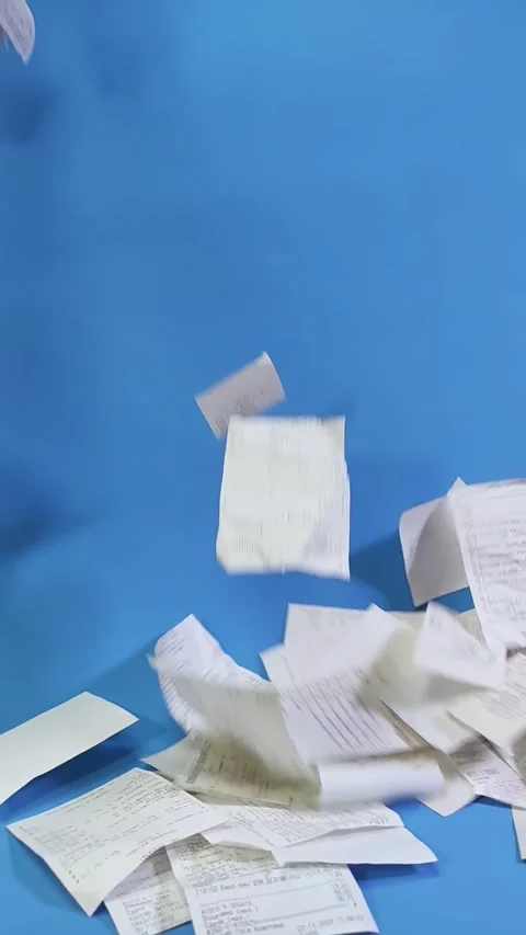 Grocery receipts. Stack of cash receipts for purchases on blue background Stock Footage 294183092