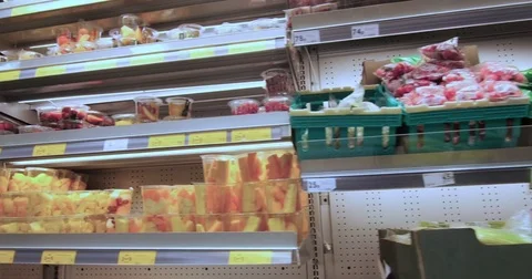 Grocery shopping at a supermarket Stock Footage 71865554