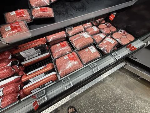 Grocery Store Ground Beef Display With Packaged Fresh Meat looking down Stock Photos