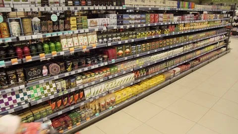 Grocery store, past the counter with tea is a buyer Stock Footage 75475801