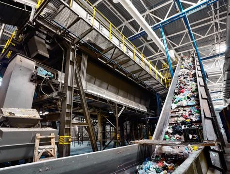 GRODNO, BELARUS - OCTOBER 2018: recycling plant conveyor belt transports garb Stock Photos
