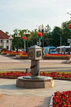 Grodno, Belarus. Zero Kilometer monument, a metallic column with embossed e.. Stock Photos