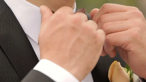 The groom adjusts his tie. close-up. Stock Footage 75073530