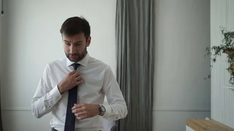 The groom adjusts his tie Stock Footage 70027697