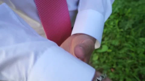 The groom adjusts the suit Stock Footage 163566760