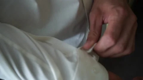 The groom adjusts the suit Stock Footage 163567147