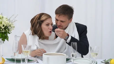 The groom and the bride feed each other Stock Footage 292901612