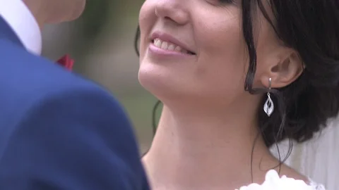 Groom and bride looking in each other's eyes smiling and talking Stock Footage 94213630