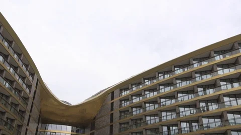 Groom and bride walking down the stairs on the luxury hotel territory near pool Video stock 94217469