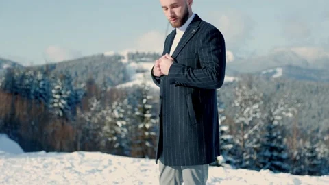 Groom on the background of snow-capped mountains Stock Footage 150620811