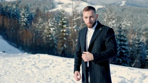 Groom on the background of snow-capped mountains Stock Footage 150732751