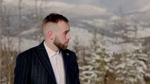 Groom on the background of snow-capped mountains Stock-Footage 150962065