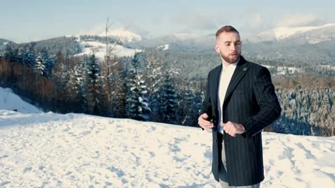Groom on the background of snow-capped mountains Stock Footage 151246979