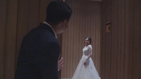 Groom to Be Glancing at His Beautiful Fiancee from Afar Stock Footage 334020147