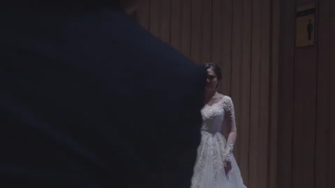 Groom to Be Glancing at His Beautiful Fiancee from Afar Stock Footage 334020173