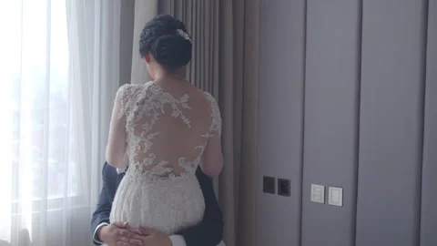 Groom to Be Sitting and Embracing His Standing Fiancee Stock Footage 334029954