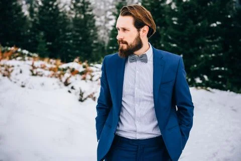 Groom in a blue suit in the mountains Carpathians Stock Photos
