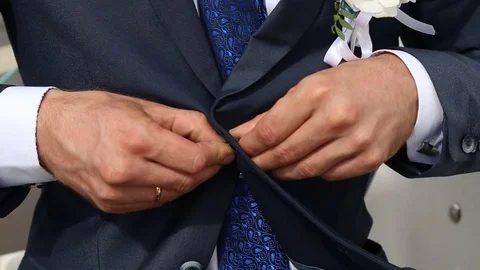 Groom buttoned tuxedo and corrected then Stock Footage 73104225