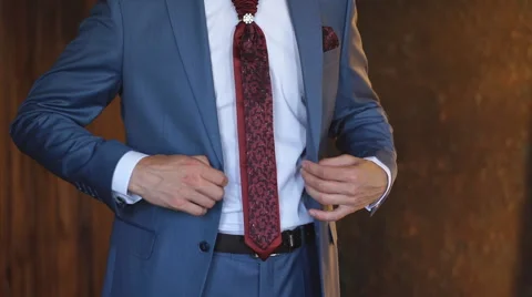 The groom buttoning his jacket Stock Footage 68729526