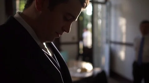 Groom Buttoning a Suit Stock Footage 75017660