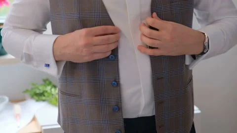 Groom is buttoning a vest. Stock Footage 132250950
