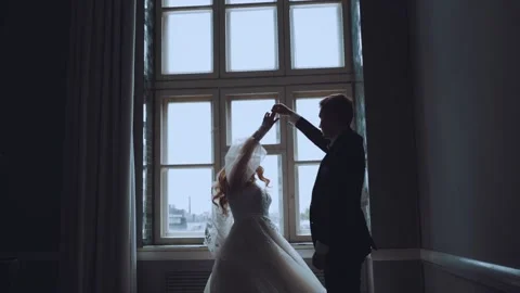 The groom circles the bride by the hand Stock Footage 219377995