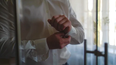 The groom clasps sleeves Stock Footage 93842839