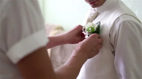 Groom corrects the buttonhole Stock Footage 47450940