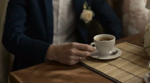 The groom drinking coffee Stock Footage 60389711
