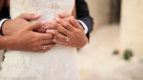 The groom embraces the bride on the beach. Wedding in Montenegro Stock Footage