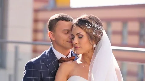 The groom embraces the bride Stock Footage 75618732