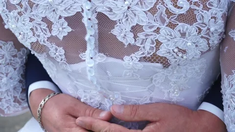 The groom embraces the bride Stock Footage 163566741